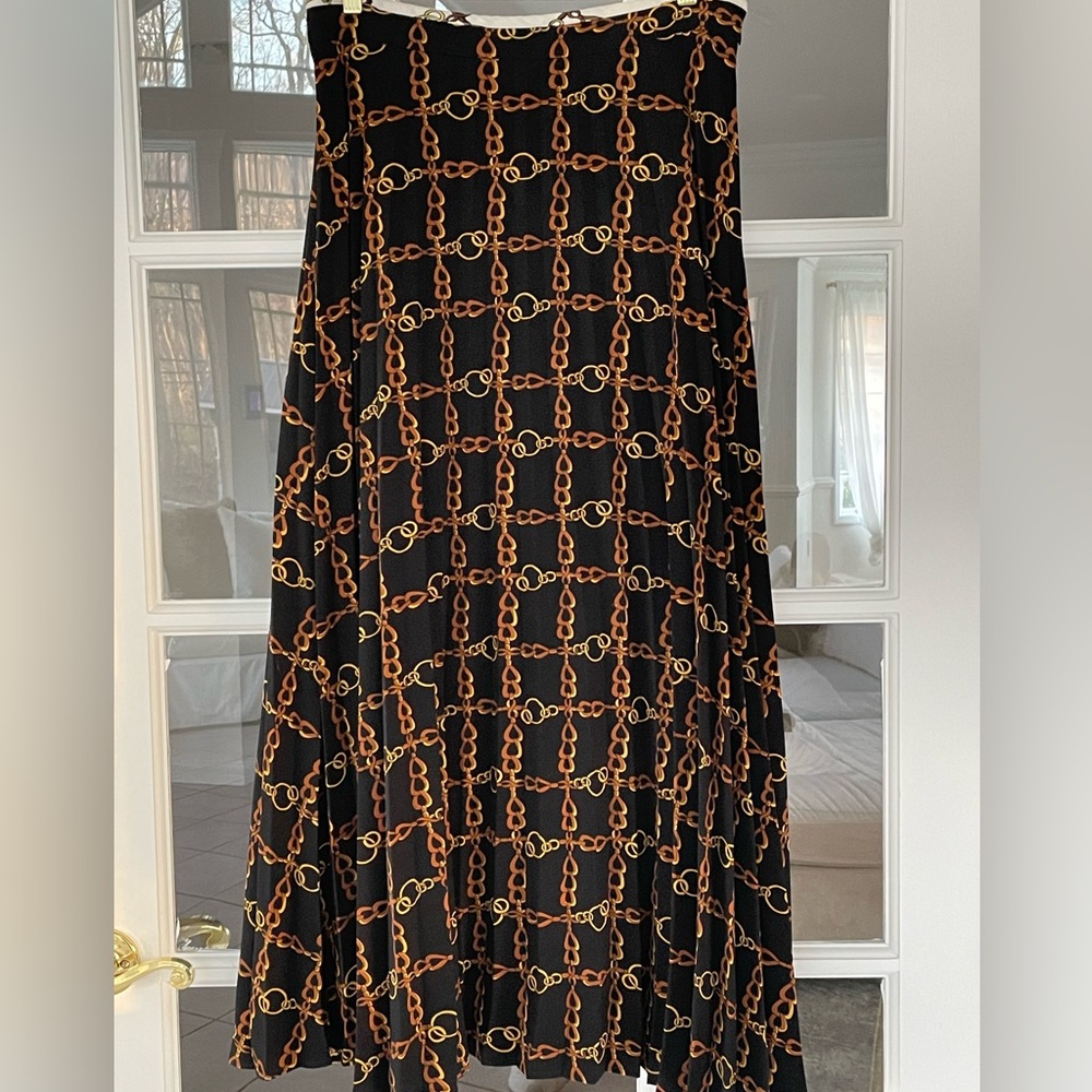 Black pleated maxi skirt with chain print and white waistband detail
